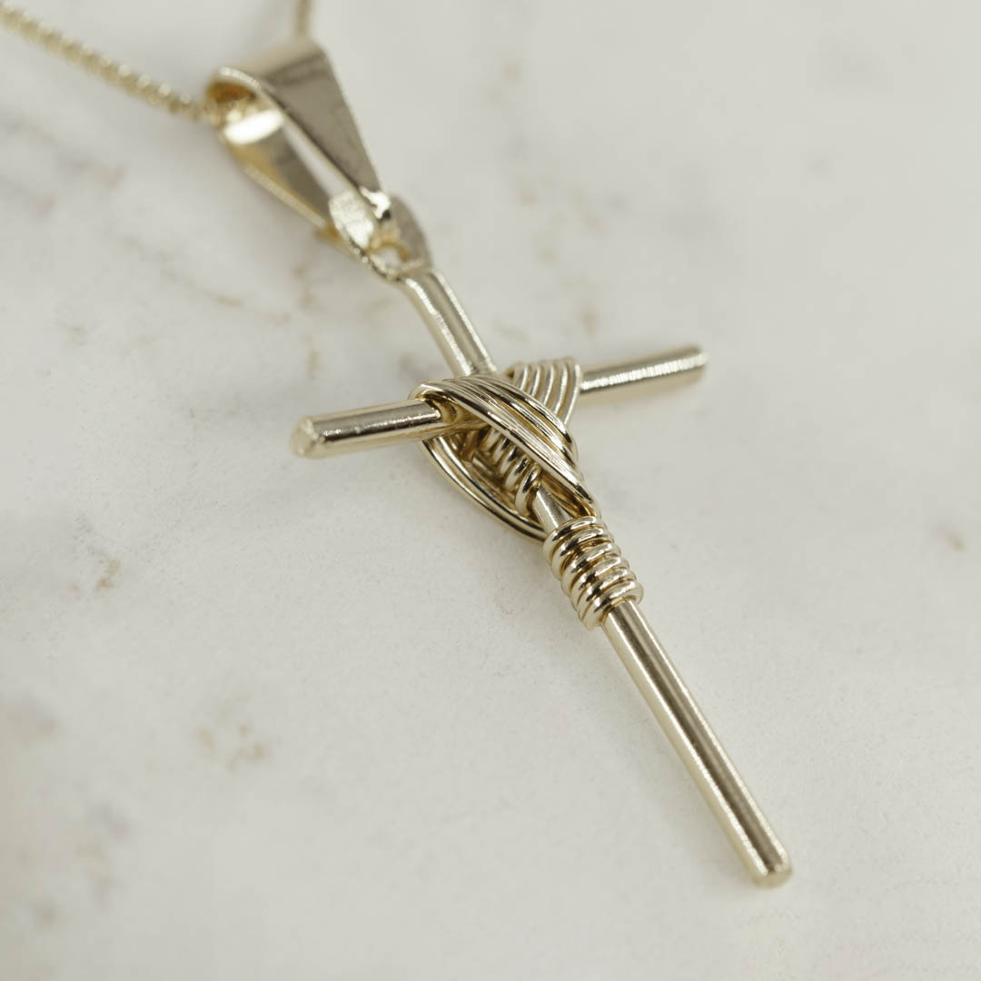 DIJE CRUZ ENTRELAZADA